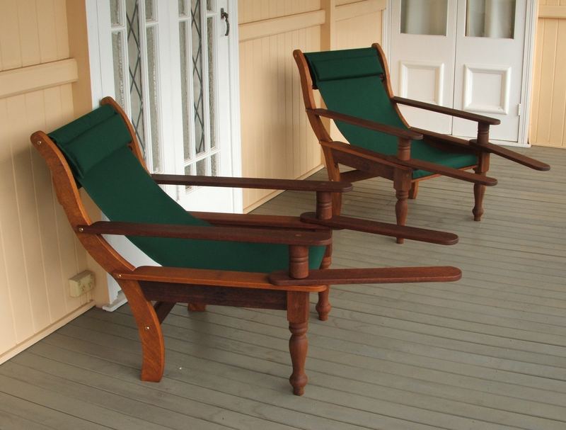 Two Squatters chairs with green canvas on a verandah