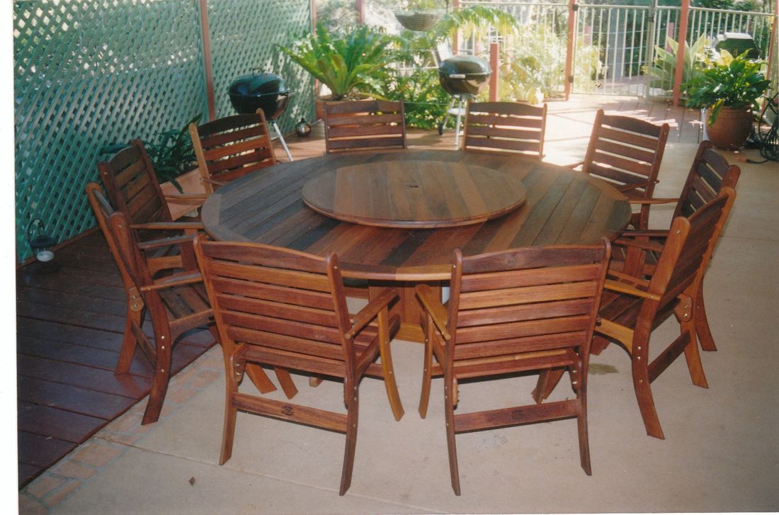 Large round Kwila table with lazy Susan and Laguna high back chairs