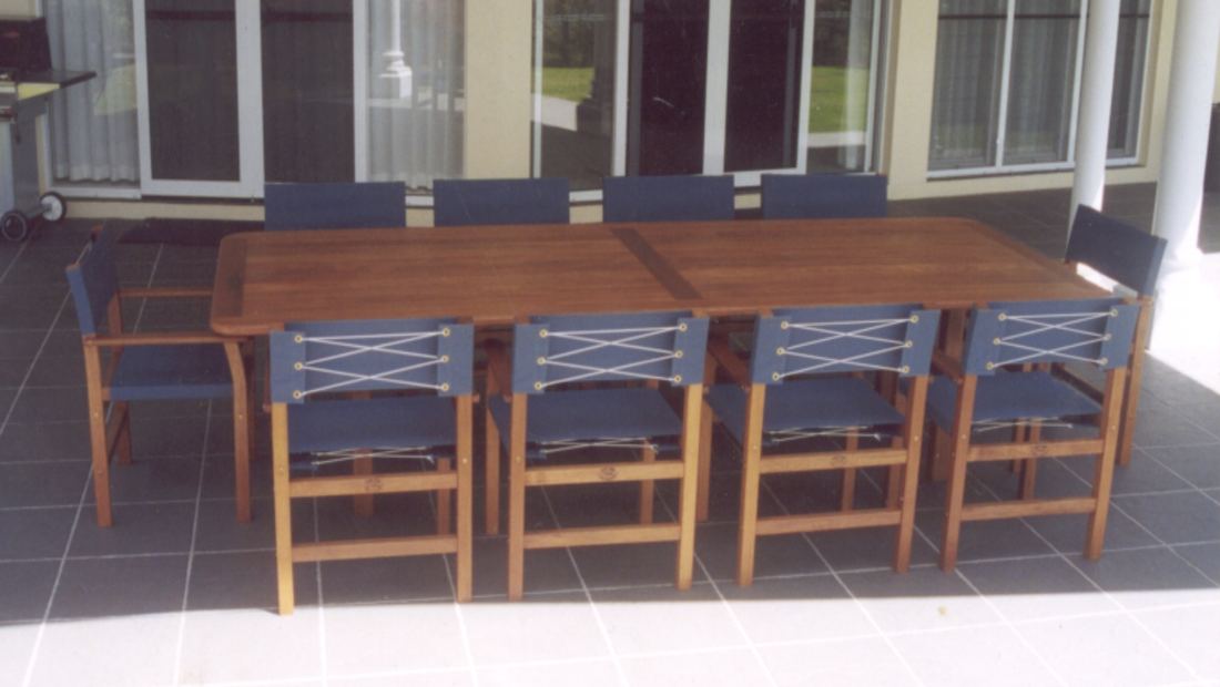 Three-metre Kwila table with blue Miami chairs on a tiled verandah