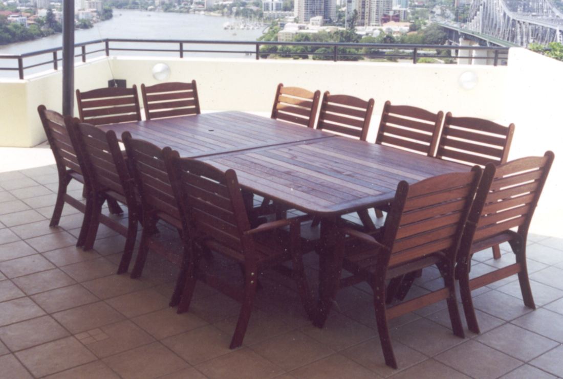Two square Kwila tables joined, with Laguna high back chairs, on a riverside balcony