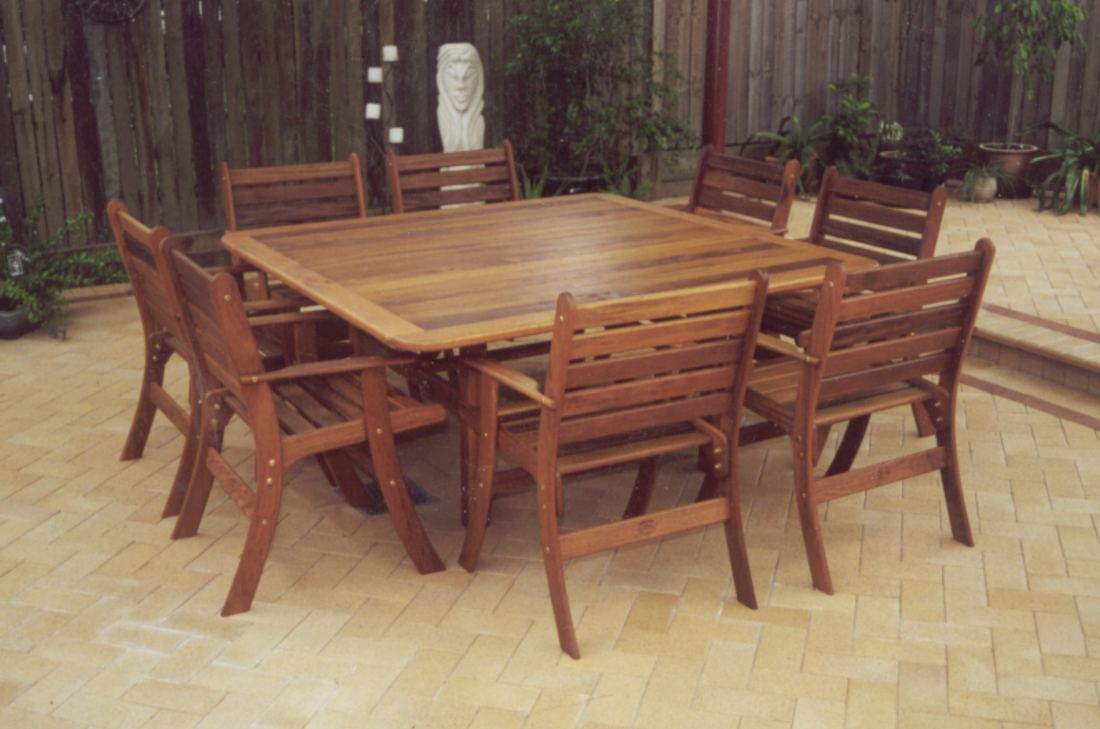 Large square Kwila table with Laguna chairs on sandstone pavers